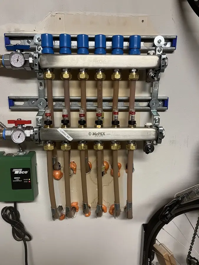 Plumber performing Water Heater Repair at a residential property in Demarest